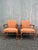 This pair of vintage Queen Anne style arm chairs features newer orange upholstery, solid wood arms and legs. These chairs...