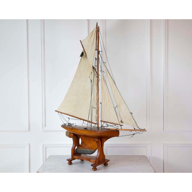 Made in England in the twentieth century, this wooden pond yacht is rigged as a gaff cutter. Models of this kind were...