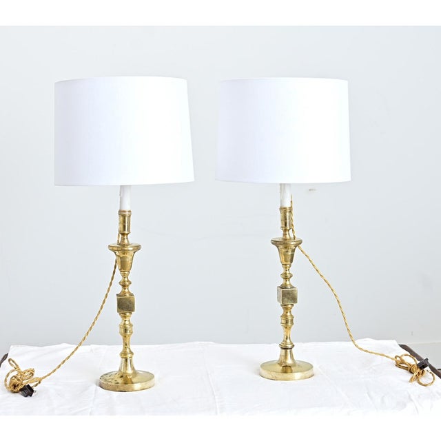 Polished in taste and patina, these mid-20th century large-scale, heavy French candlesticks have been converted to table...