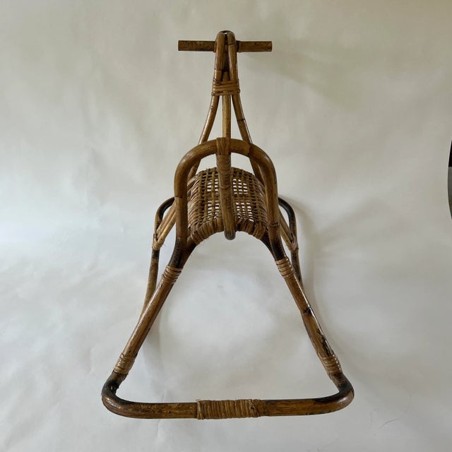 A great mid-century design styled after Franco Albini, architect and designer (1905-1977). The rocking horse features a...