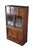 An antique Meiji era Cha Tansu Tea Cabinet. Features a burled frame. Features a central display portion with etched glass...
