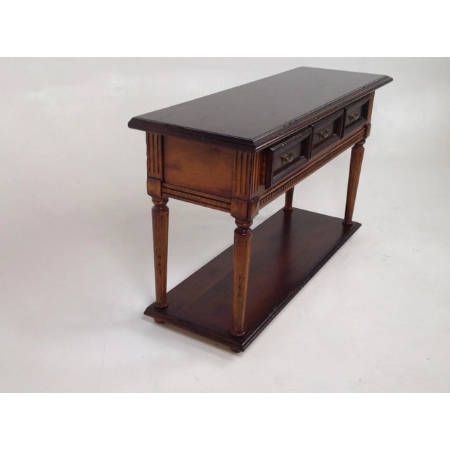 Tuscan style console. Console is made of alder and done in a beautiful 2 tone walnut finish. The piece is well made and...