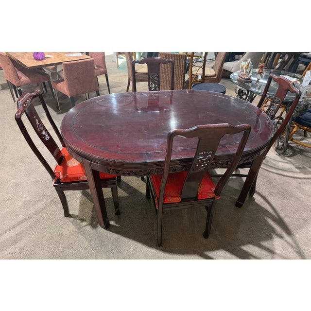 Elegant and richly detailed, this Asian-style dining set brings timeless craftsmanship and refined character to any dining...