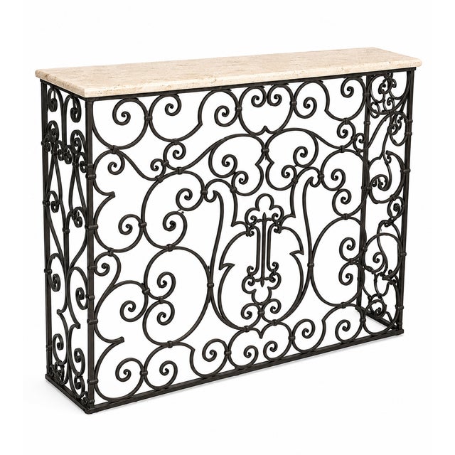 A statement of timeless craftsmanship, this striking console table pairs hand-forged iron artistry with the understated...