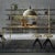 This pendant lamp features a bell-shaped brass structure recalling lighting used in historic industrial factories,...