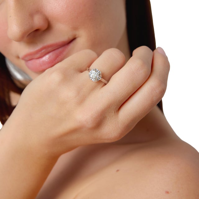 This elegant French Art Deco engagement ring centers on a captivating 1.18 carat old mine cut diamond, certified by GIA...