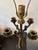 Elegant and substantial pair of vintage four-arm candelabra table lamps featuring richly cast neoclassical styling with...