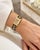 Enhance your collection with this striking Hermès watch, a fusion of artistry and luxury. The timepiece features a gold-...