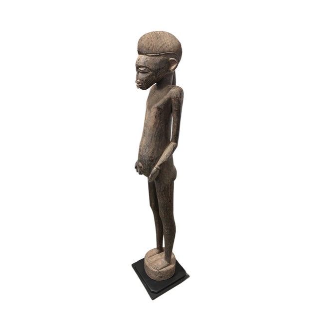 This vintage life size hand-carved African Tribal Art sculpture depicts a Standing Senufo Tyepka maternity figure from the...