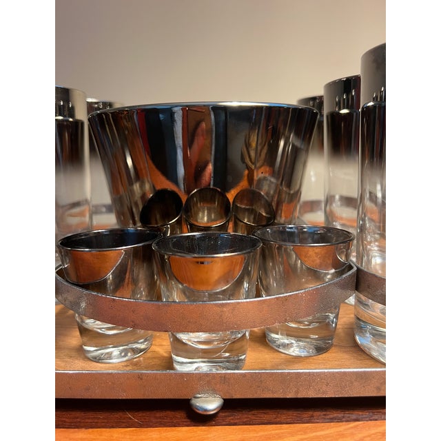 This dorothy thorpe art deco 10 piece bar glassware set with caddy tray. This tray is like a portable bar, just add ice...
