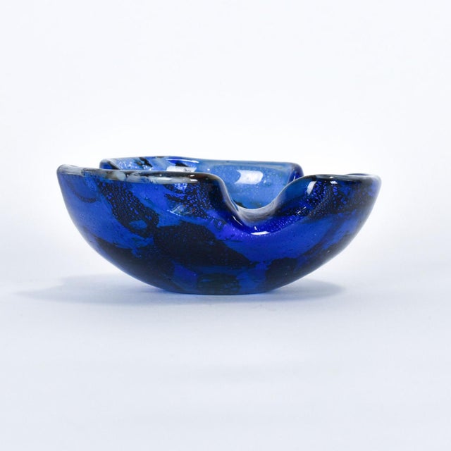 This Murano style blue bowl is from Italy, and possibly by Sommerso. It is unmarked but was imported from Italy and has...