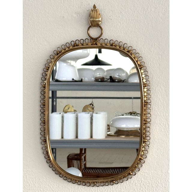 Gorgeous wall mirror with its proper leaf wall hook designed by Josef Frank in the midcentury. This mirror is made of full...