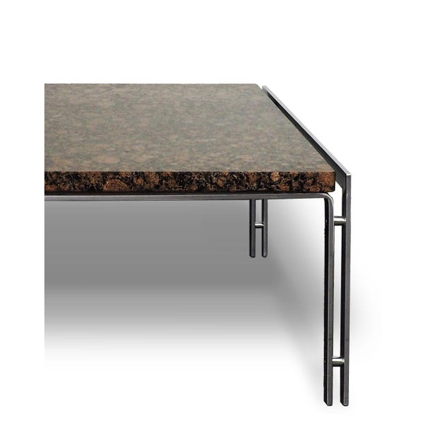 Coffee table with a natural stone top that rests on a minimalistic chrome tubular frame. The table is in excellent vintage...