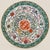 The wide, heavily potted dish is brightly enamelled to the centre with confronting phoenix surrounded with a lotus flower...
