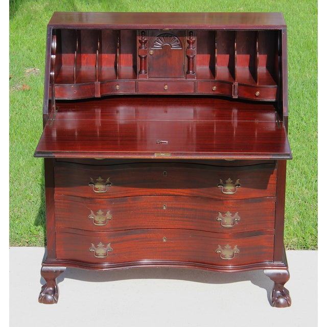 A distinguished antique mahogany slant-front secretary desk by the renowned Maddox Table Company of Jamestown, New York,...