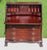 A distinguished antique mahogany slant-front secretary desk by the renowned Maddox Table Company of Jamestown, New York,...