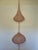 A striking monumental handwoven copper wire hanging sculpture in the style of Ruth Asawa, showcasing the delicate...