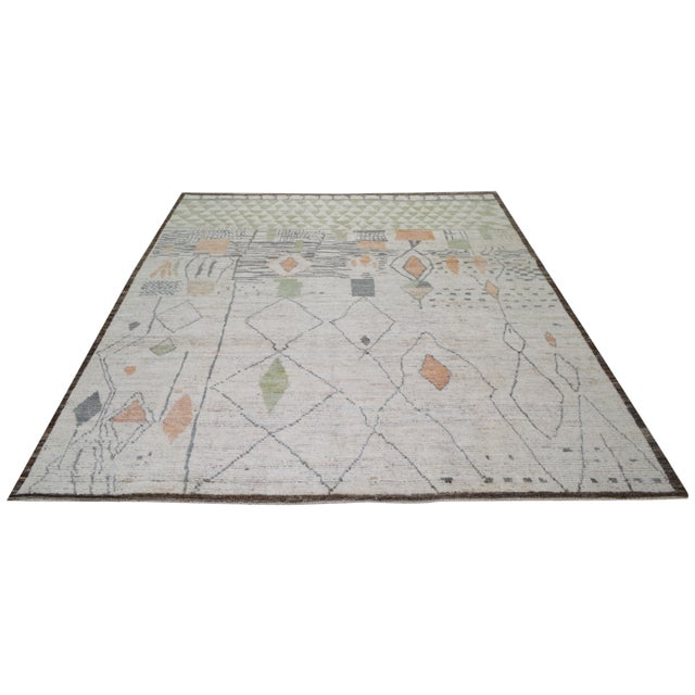 Hand-knotted with care using traditional rug making techniques, this wool rug blends timeless craftsmanship with a modern...