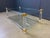 Vintage coffee table with an acrylic frame, brass corners and two glass plates. Good condition. Very modern looking and...