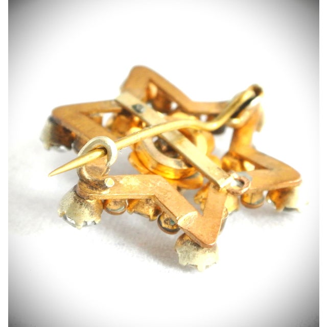 Art Deco Antique Gold Top and Crystal Star Brooch Pin with Eleven Round Faceted Crystals and One Large Center Crystal in...