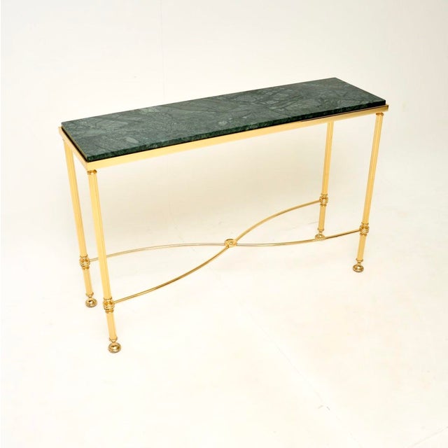 A fantastic vintage French brass and marble console table, dating from the 1970’s. It is of great quality with a very...