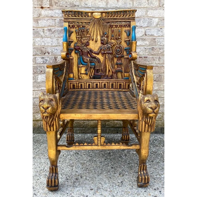 Fabulous Egyptian revival style carved, gilt, and painted throne-like chair.
