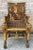Fabulous Egyptian revival style carved, gilt, and painted throne-like chair.