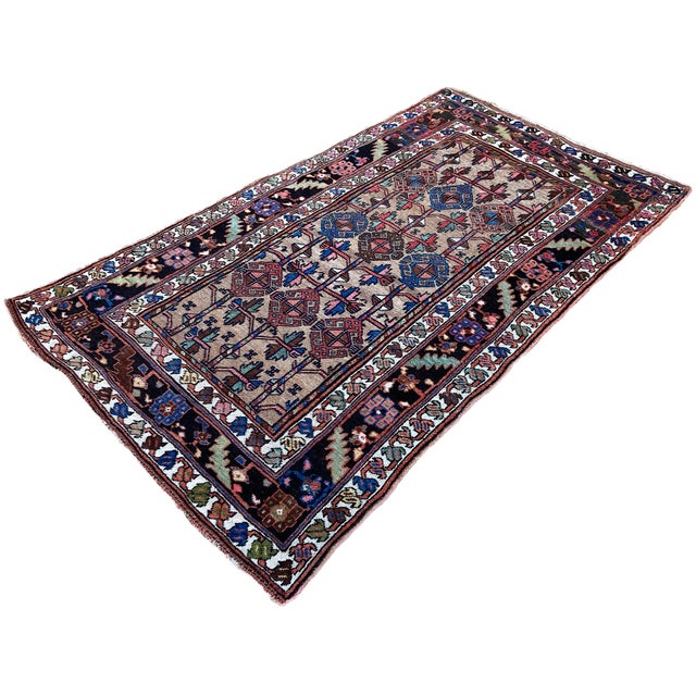 A wonderful antique rug, handwoven by nomadic Kurds circa 1900. The rug features an all over geometrical design on an...
