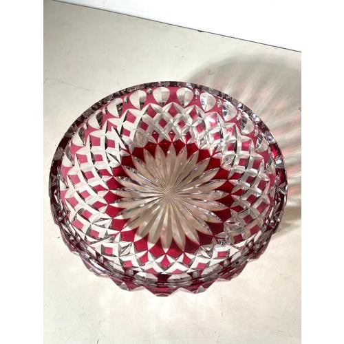 Exceptional Val Saint Lambert crystal bowl in a rich ruby red overlay with intricate hand-cut decoration. The deep red...
