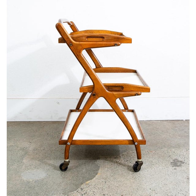 3 tier Italian rolling / serving bar cart. The top 2 surfaces are removable. Unstamped example. Rolls smoothly and easily.