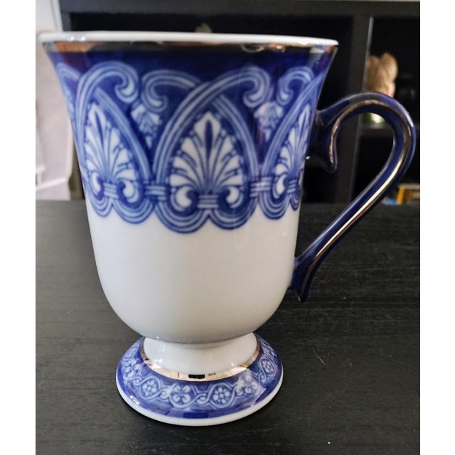 A pair of Bombay Company Tile Mugs. They were my mom's, she loved them, unfortunately I'm moving and I cannot bring them