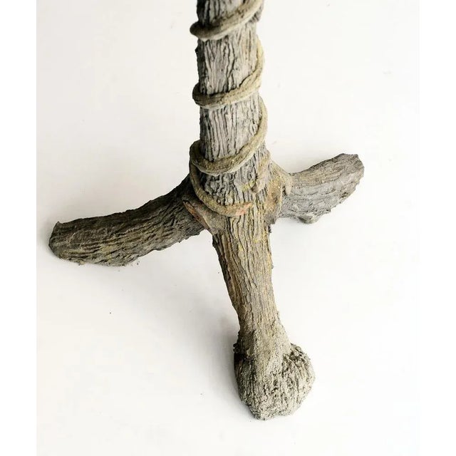 Pretty table with wood imitation cement feet.