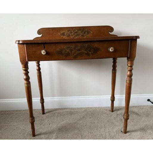 A beautifully preserved two-piece set consisting of a mid-20th-century L. Hitchcock writing desk and its original matching...