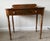 A beautifully preserved two-piece set consisting of a mid-20th-century L. Hitchcock writing desk and its original matching...