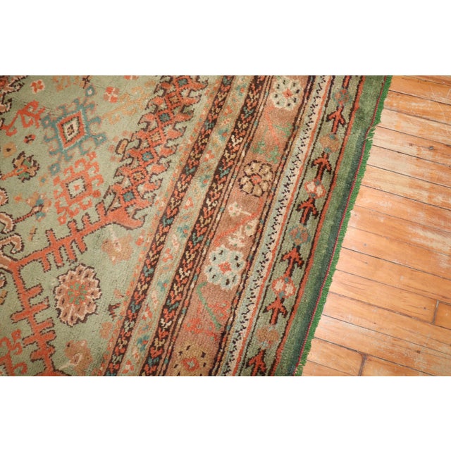 an early 20th Century Irish Donegal large square-size rug in a leprechaun green and pumpkin rug no. j3121 size 13' 2" x...