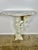 Pair of 1930s Italian cherub consoles with marble tops. The pair is opposing and both holding flamed torchiers. The wood...