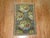 An early 20th century Persian Senneh rug featuring a Gol- Farang design, dominant accents in sky blue and chartreuse....