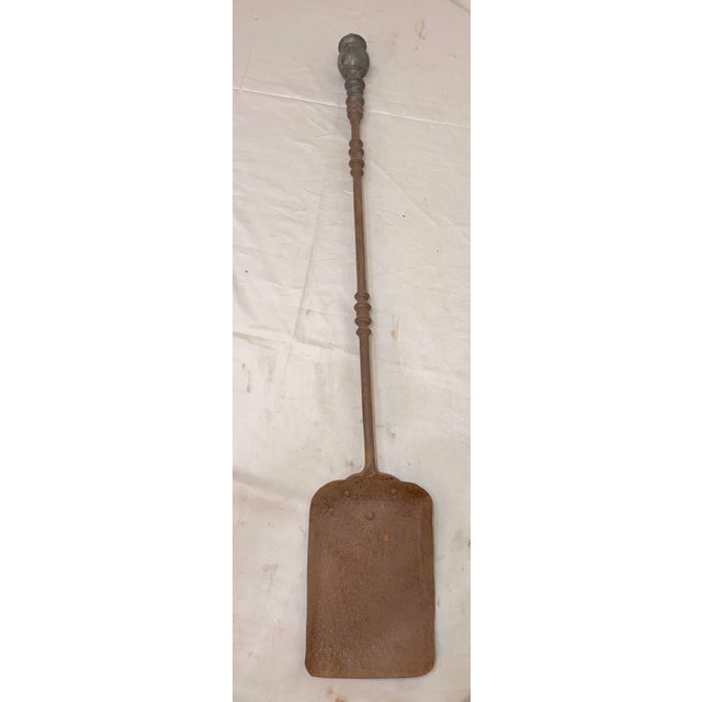 Up for sale is a rare antique 18th century wrought iron and brass English fireplace shovel. The shaft and blade are...