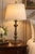 A beautifully proportioned vintage Neoclassical table lamp distinguished by a tall fluted baluster body, sculptural...