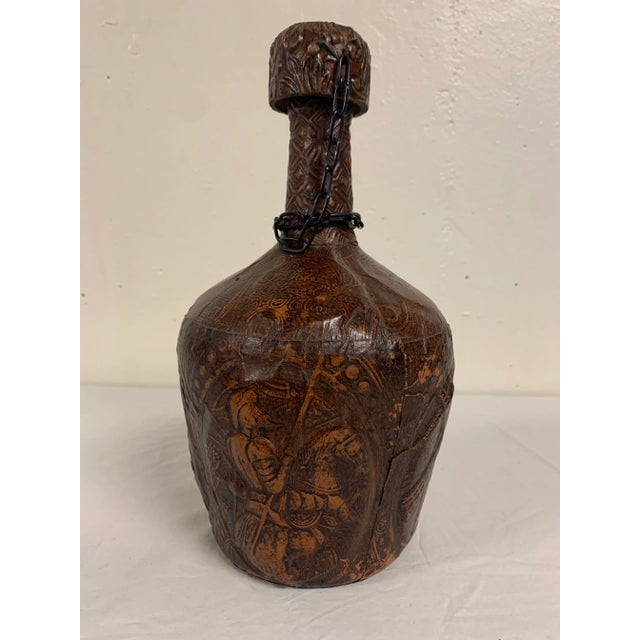 Vintage Bottle wrapped in Embossed Goat Leather, depicting multiple images (Miguel De Cervantes, Don Quixote, Sancho Panza...