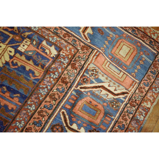 High collectible-quality large room size rust field triple medallion field early 20th century Persian Bakshaish rug. The...