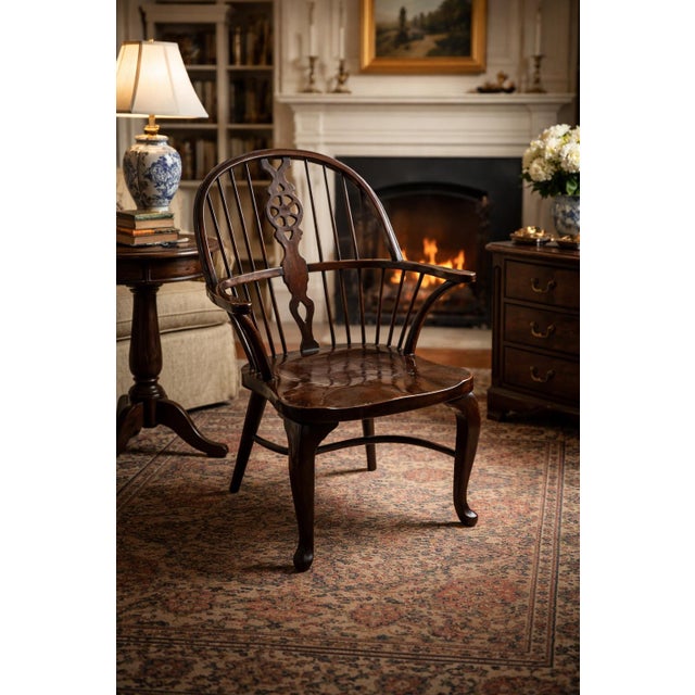 Vintage Windsor armchair in the English country tradition with a refined profile and classic spindle-back form....
