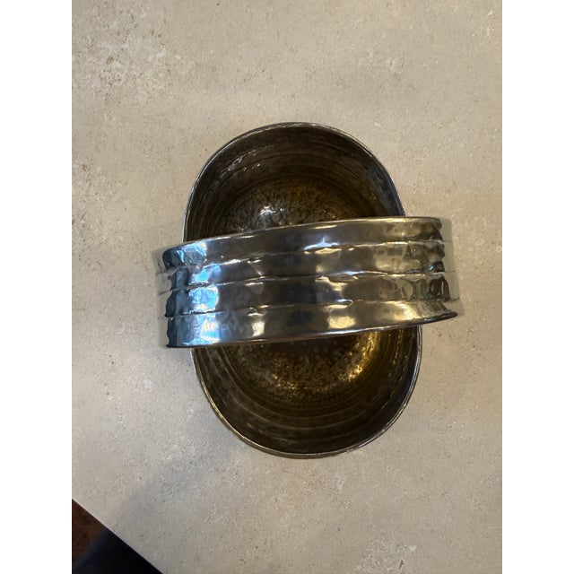 Distinctive Italian silver-plated basket from the 1970s, characterized by its bold, sculptural form and hand-hammered...