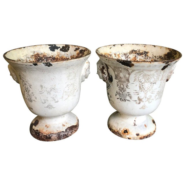 An exceptional and very rare pair of "Emaille De Rouen" - enameled cast iron urns from Rouen, France. Stunning form with...