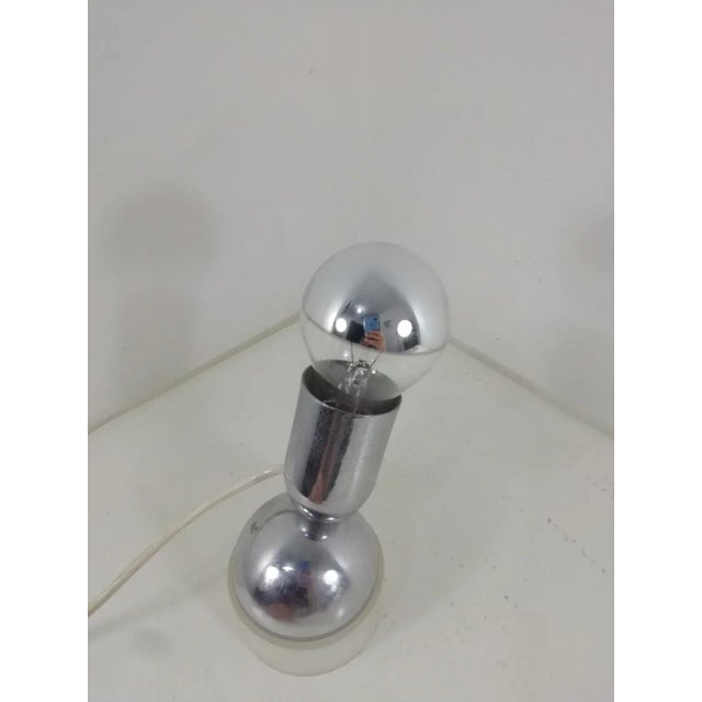 Pollux table lamp. Design Ingo Maurer for Design M. Methacrylate base, stainless steel body. Good condition. Integrates in...