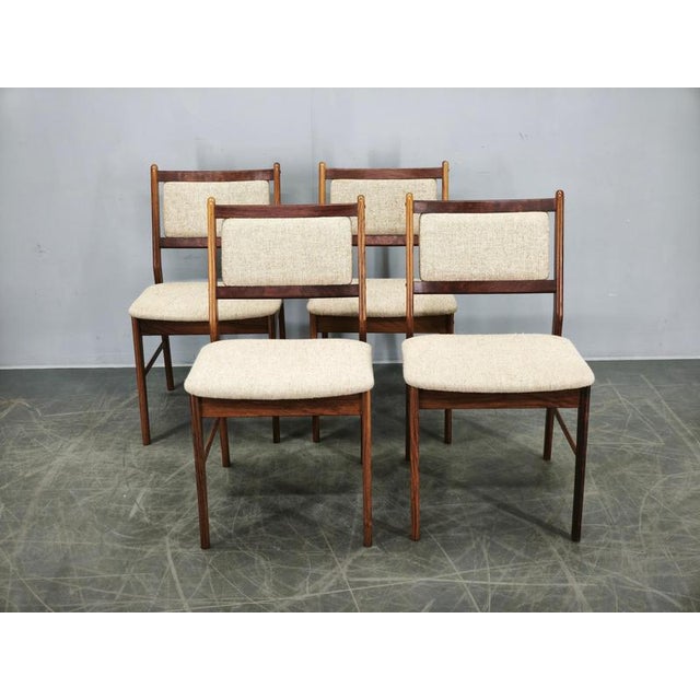 An elegant set of four authentic Danish Modern dining chairs designed by Hugo Frandsen and produced by Spøttrup...