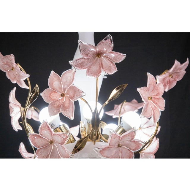 Vintage Murano glass chandelier with pink flowers. The chandelier has 5 light point with E14 socket. The frame is made of...