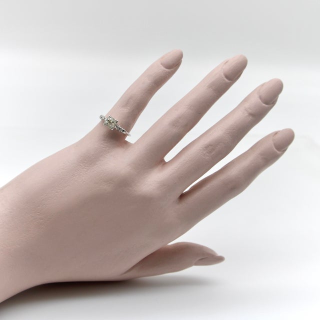 This 14k white gold Art Deco ring features a diamond that is older than the ring. The antique Victorian era diamond is Old...