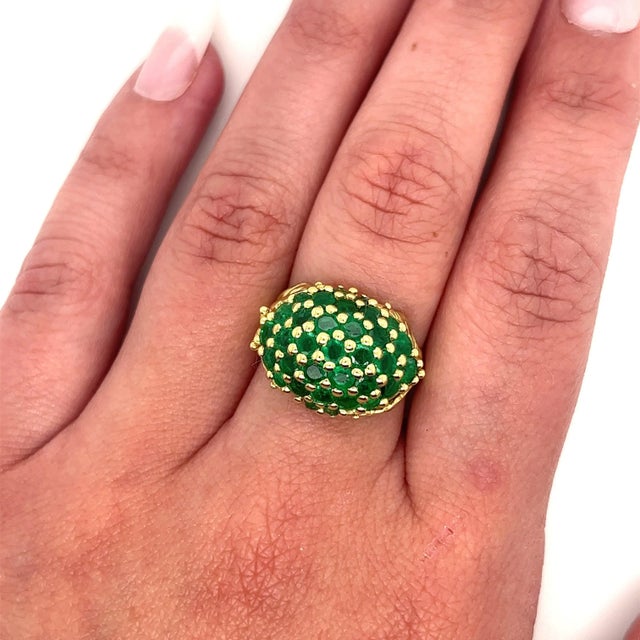 Natural round cut emerald cluster ring with a carved leaf detail is a stunning piece of jewelry that combines classic...