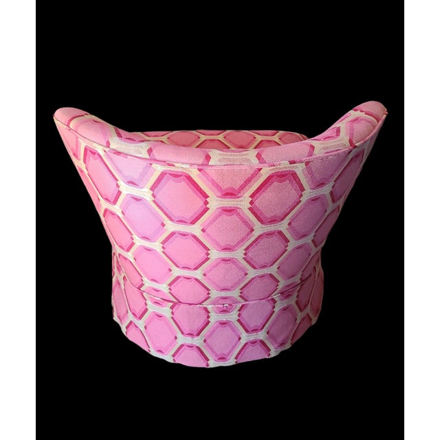 Stunningly bold 1970's Op-Art swivel chair in pink. The chairs' voluptuous silhouette offsets the optically dynamic...